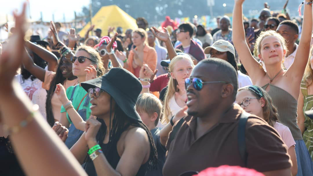 Festival goers singing along with the choir.